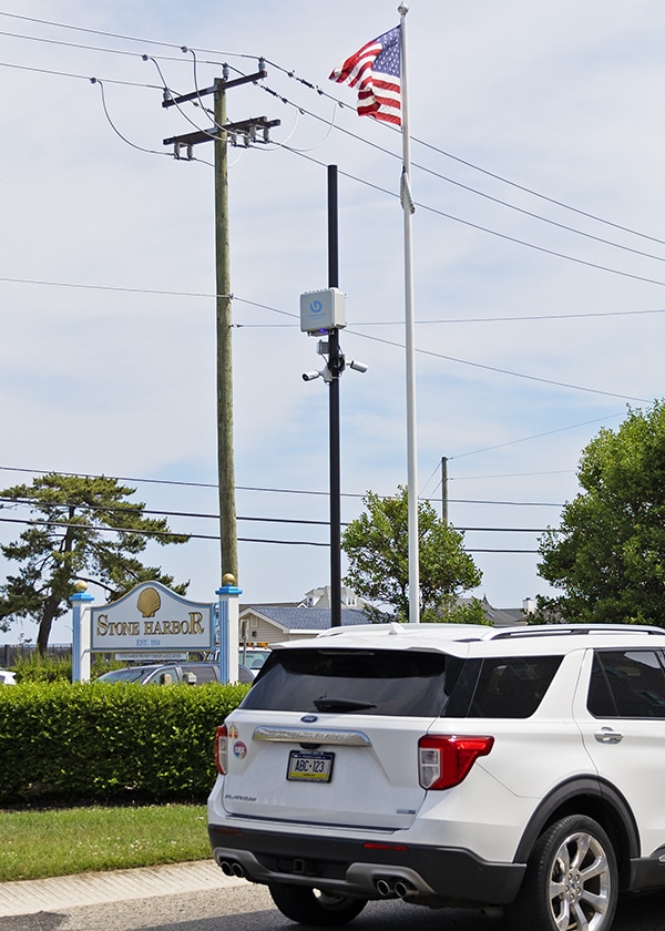 An AC powered Gridless Sentry unit and two bullet security cameras overlook traffic down two sides of a road in the Town of Stone Harbor.